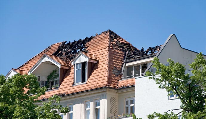 A fire damaged tiled roof for residential fire restoration