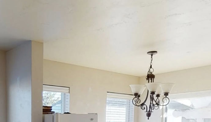 A white ceiling and chandelier for smoke damage assessment