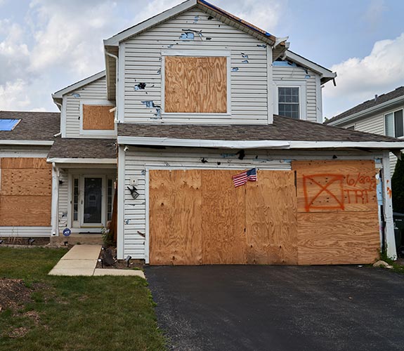 Boarded-up residential property.