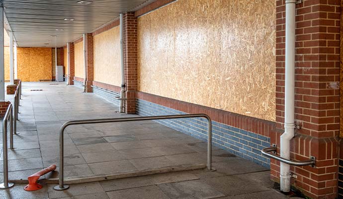 Boarded up windows on commercial building