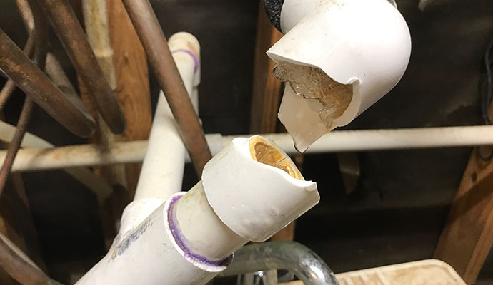 Close-up of a broken pipe leaking water