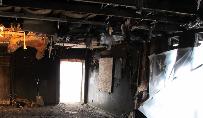 Charred room with debris