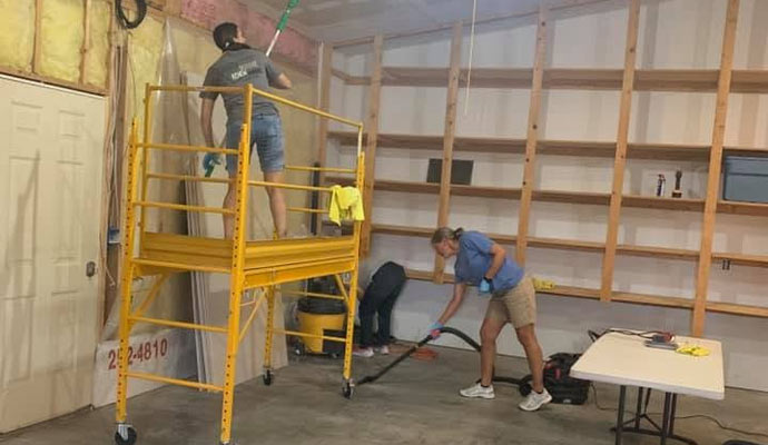 Crew cleaning a garage