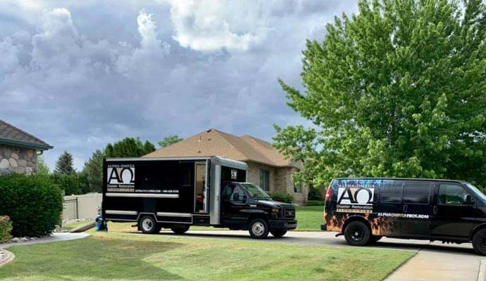 Alpha Omega Disaster Restoration service vehicles