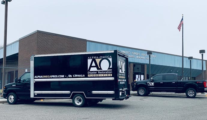 Alpha Omega Disaster Restoration service vehicle