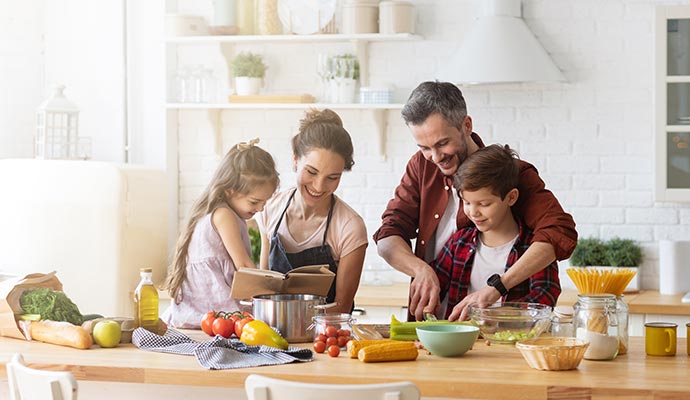 Happy family cooking in a safe home environment