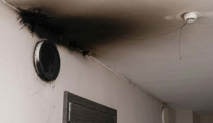 Soot damage on wall and ceiling