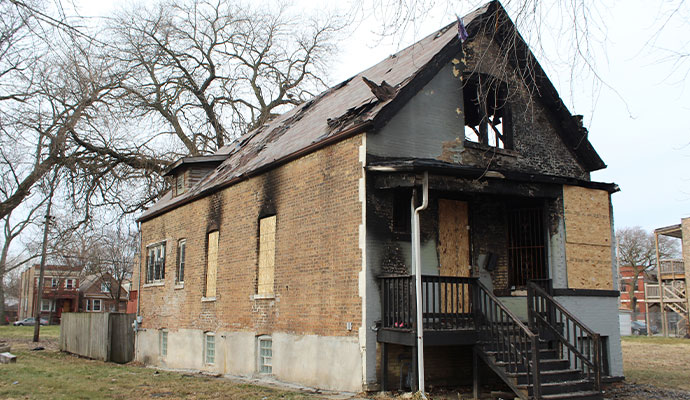 Fire damaged board up house
