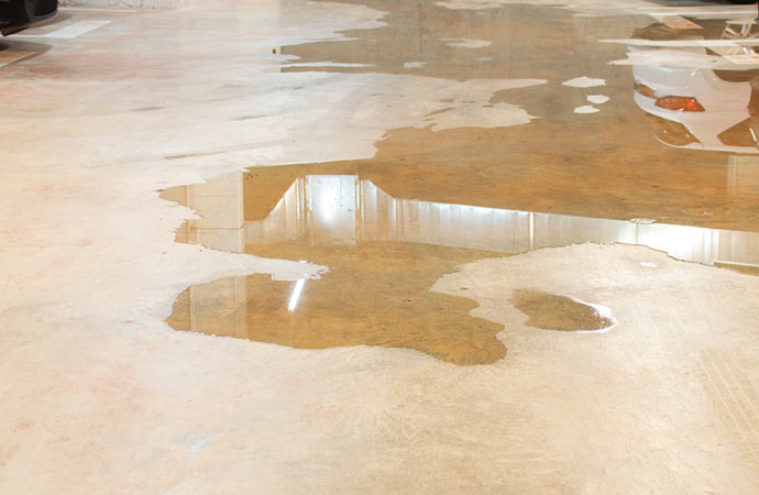 Room inundated with water due to floor leaks.