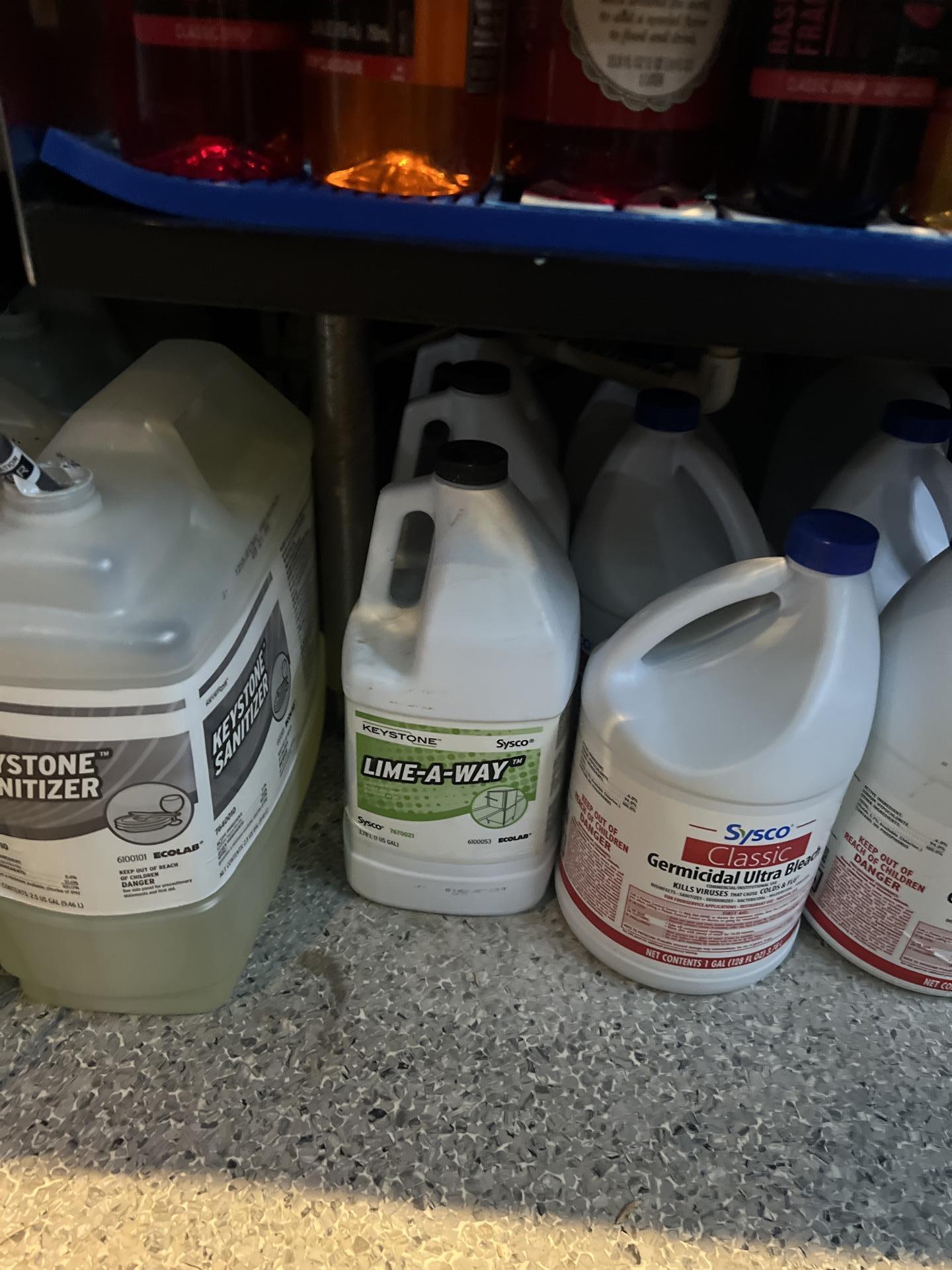 Close-up of warped white bathroom cabinetry caused by moisture absorption. Our property restoration team performed an assessment to begin targeted water mitigation and structural drying