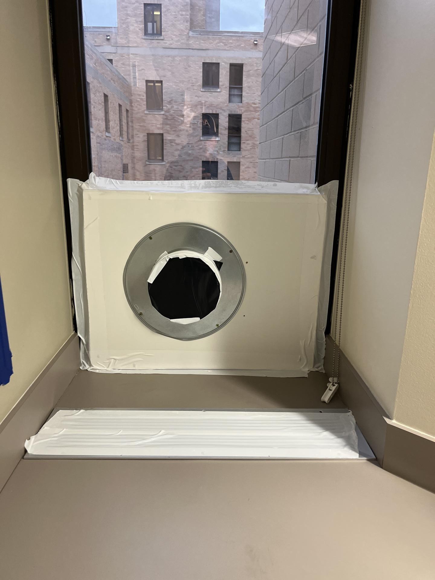 Professional property restoration team installing a heavy-duty containment barrier to isolate moisture. This essential step in water mitigation ensures proper humidity control and stabilizes the environment to prevent mold growth in a commercial or healthcare setting.