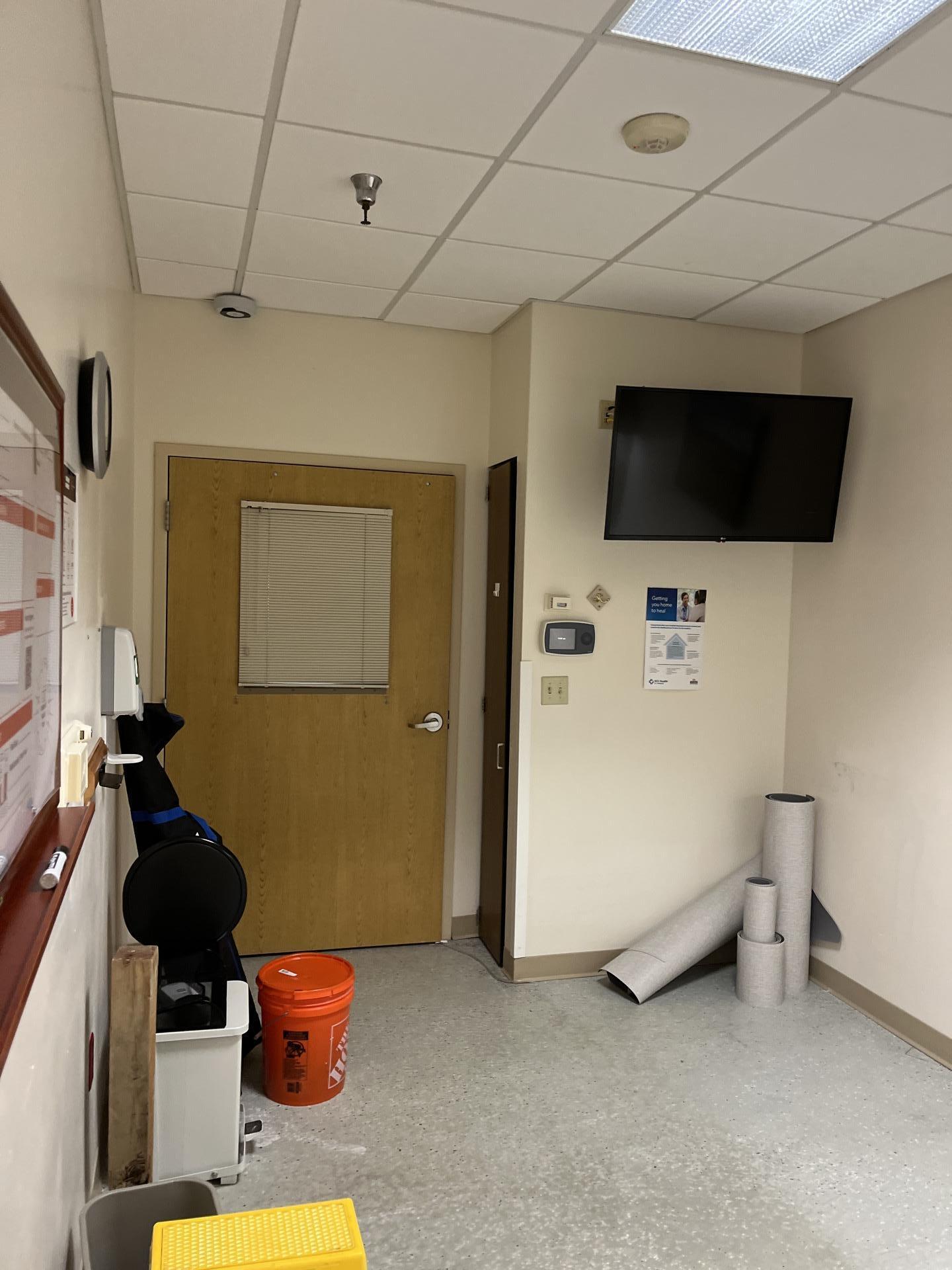 Professional property restoration team utilizing a heavy-duty containment barrier and moisture control setup during a commercial water mitigation project to stabilize the environment and prevent cross-contamination