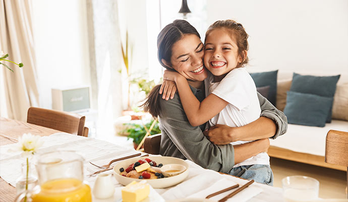 Mother and daughter at breakfast