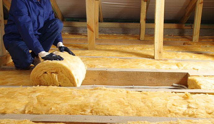 Professional worker replacing insulation