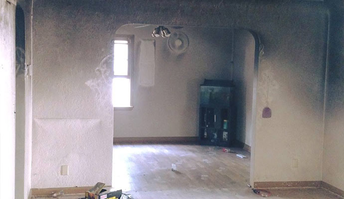 Rooms with heavy soot on walls from smoke damage