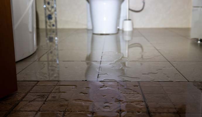 Sewage water leak on bathroom floor