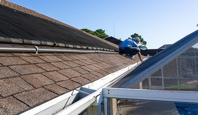 An expert inspecting a house roof