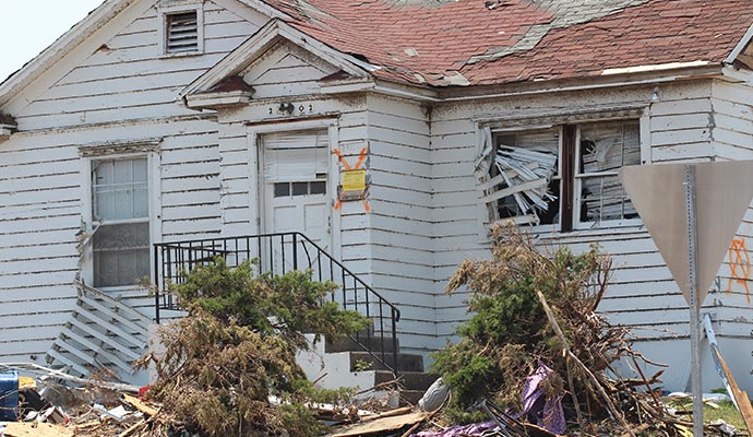 Wind-damaged house exterior