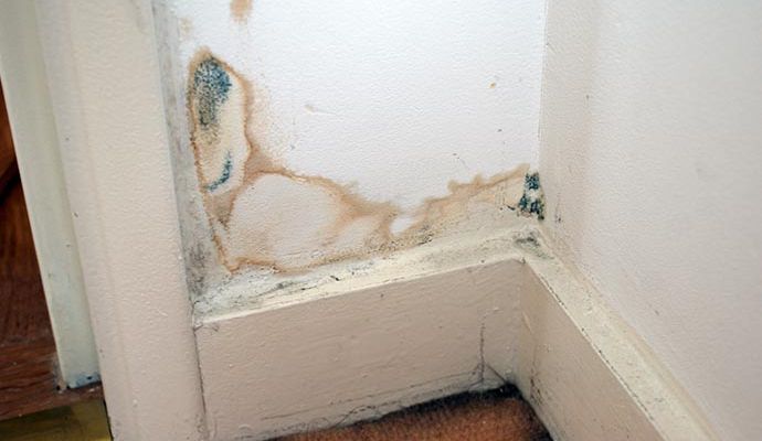 Structurally damaged wall with visible water stain