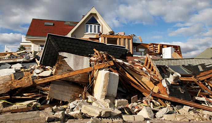 Tornado damaged property with debris and broken structures