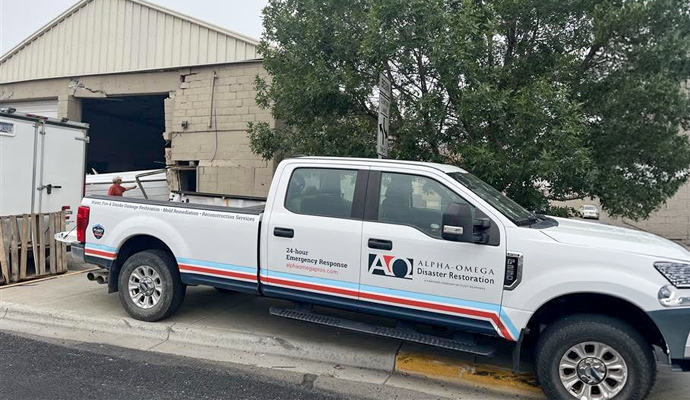 Service pickup truck parked outside a commercial building