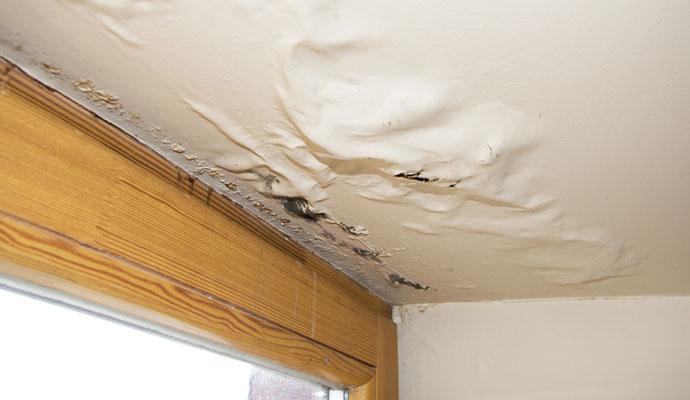 Water damaged ceiling due to roof leak