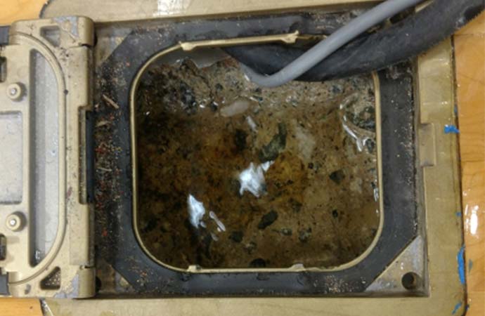 water trapped in the floor cavity