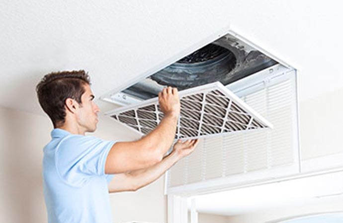 worker removing duct system smoke in Billings